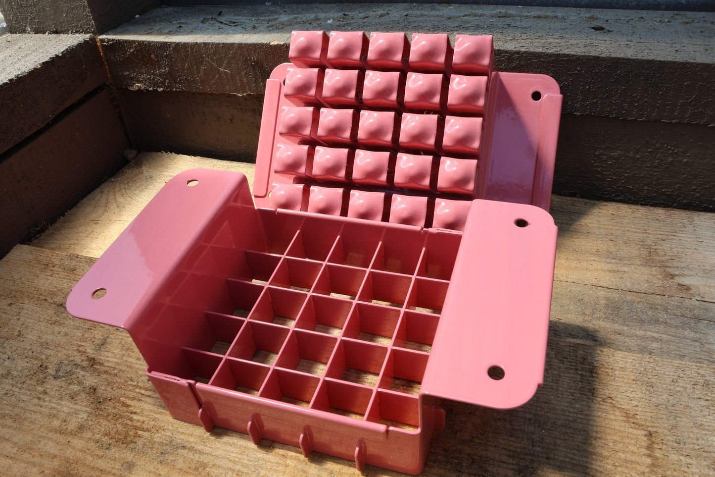Nano 25 pink soil blocker open with the 25 block press plate raised