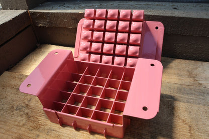 Nano 25 pink soil blocker open with the 25 block press plate raised