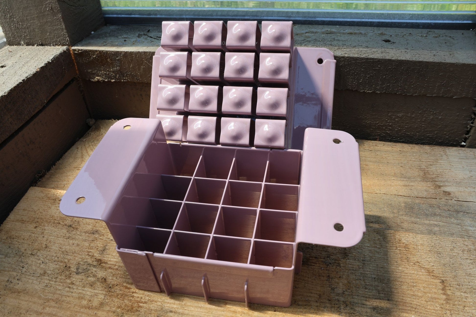 Lavender Nano 16 open, showing sixteen cells for 1.125 inch soil blocks
