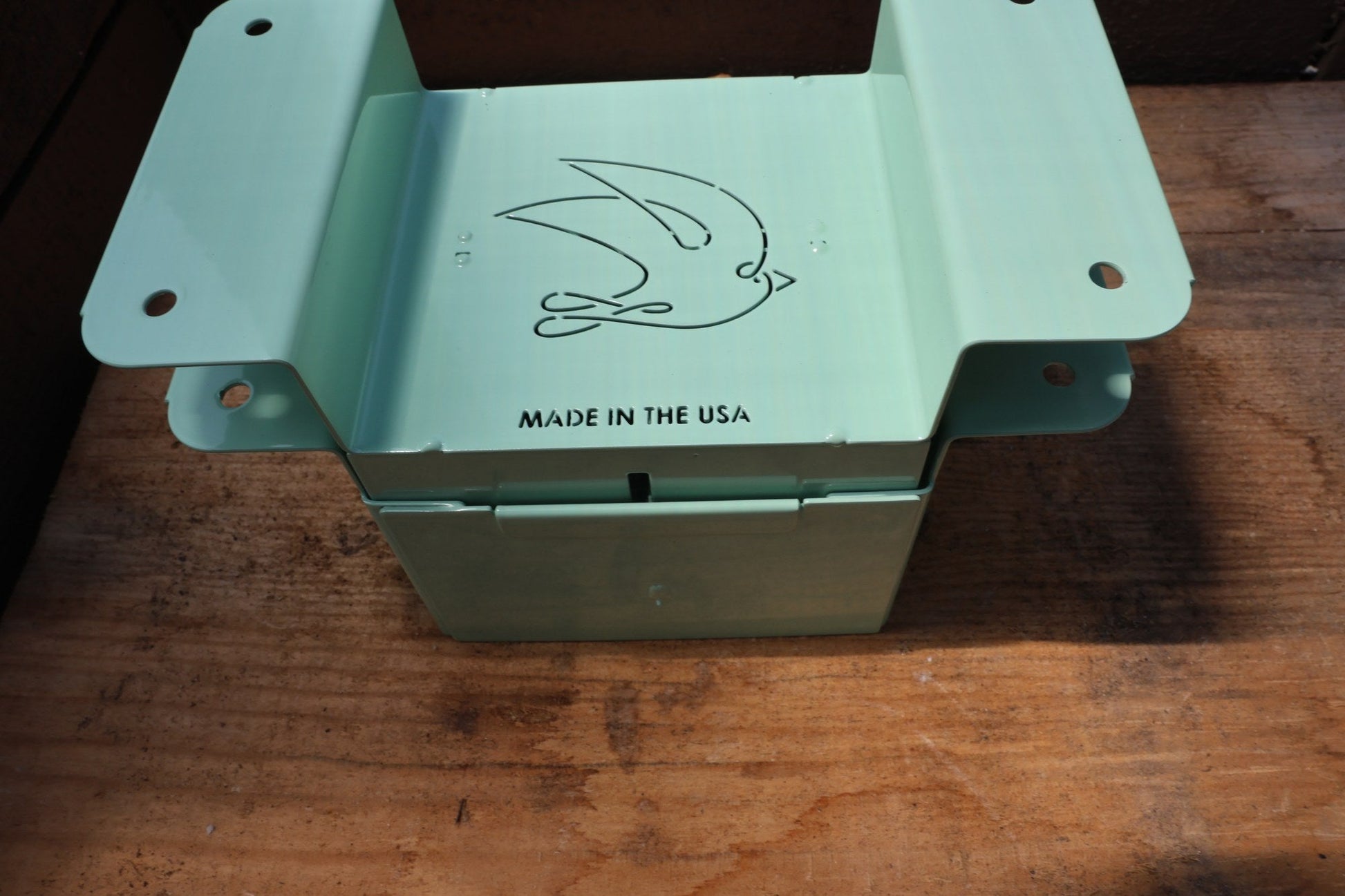 Nano 4 soil blocker in green with the stamped swallow logo and Made in the USA mark