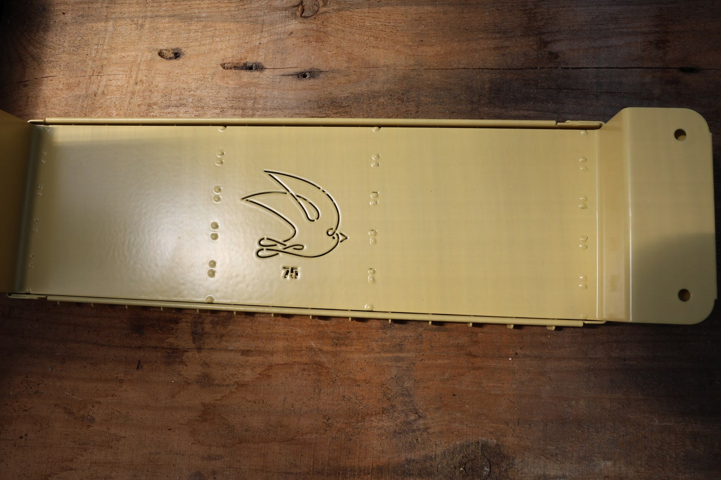 Swift Blocker Mini 75 soil blocker in yellow with the stamped swallow logo