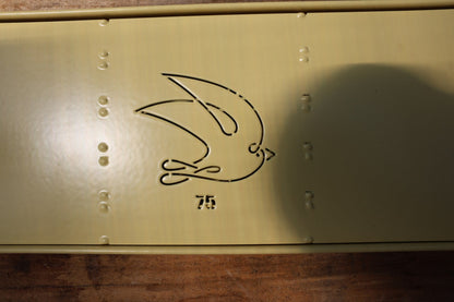 Close-up of the swallow logo and 75 stamp on the Swift Blocker Mini 75