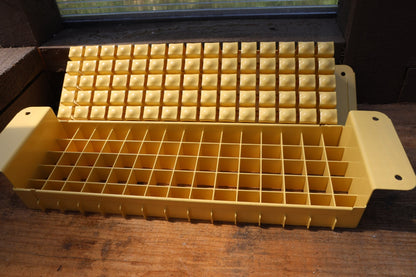 Swift Blocker Mini 75 open, showing 75 small soil block cells in a single press