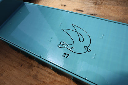 Close-up of the swallow logo and 27 stamp on the Swift Blocker Mini 27